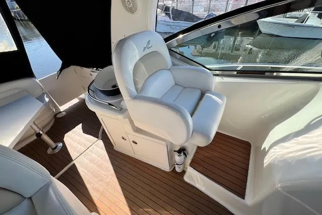 Slide: The Image of Luxurious 2008 Sea Ray 340 Sundancer boat interior with plush seating and wood flooring. - 8