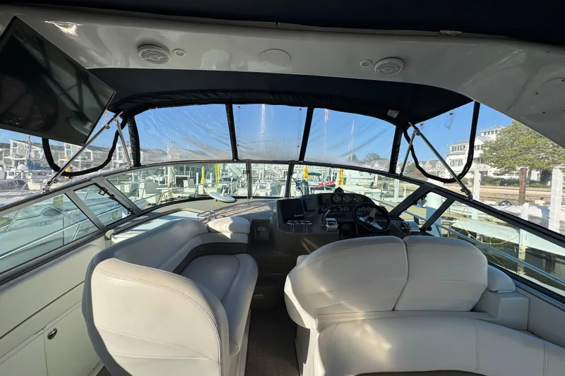 Slide: The Image of Interior view of 2004 Four Winns 378 Vista yacht cockpit with seating and controls. - 14