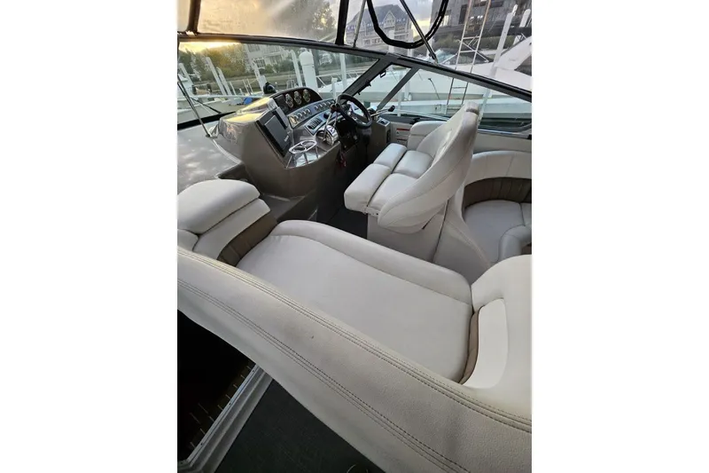 Slide: The Image of Luxurious interior of 2004 Four Winns 378 Vista yacht with plush seating and modern dashboard. - 24