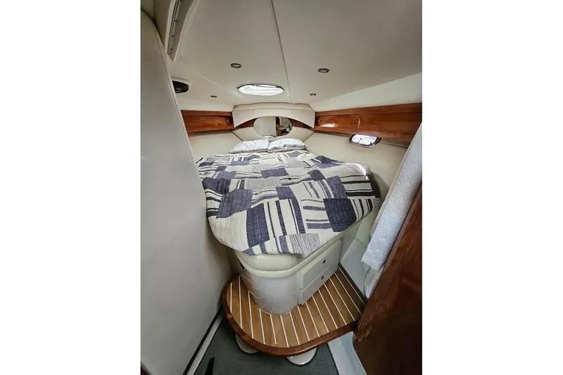 Slide: The Image of Cozy cabin interior of 2004 Four Winns 378 Vista yacht with bed and wooden accents. - 28