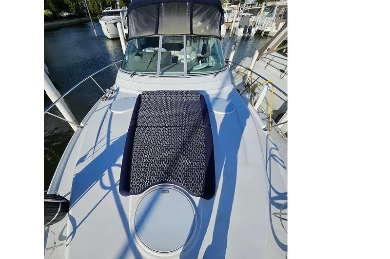 Slide: The Image of 2004 Four Winns 378 Vista yacht docked, featuring a spacious deck and sleek design. - 30