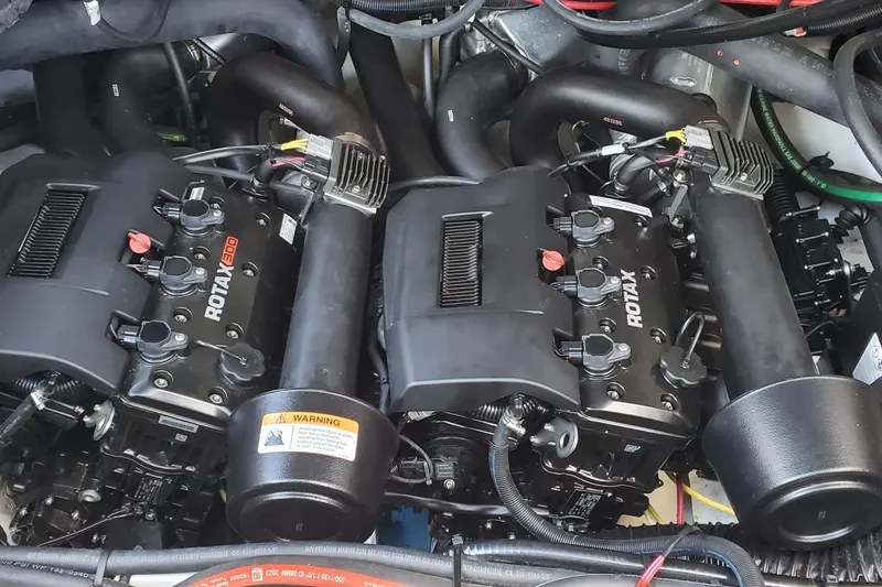 Slide: The Image of Twin Rotax engines in 2024 Scarab 285 Wake ID boat engine compartment. - 11