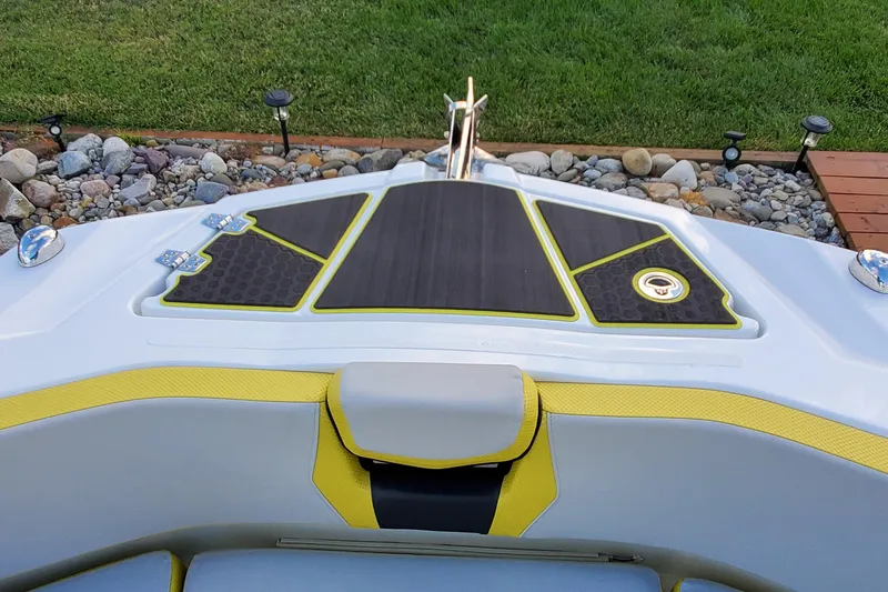 Slide: The Image of 2024 Scarab 285 Wake ID boat deck with yellow accents and sleek design. - 21