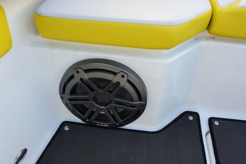 Slide: The Image of 2024 Scarab 285 Wake ID boat interior with yellow seating and JL Audio speaker. - 22