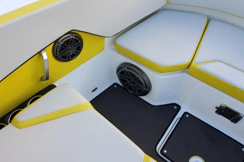 Slide: The Image of 2024 Scarab 285 Wake ID boat interior with yellow accents and built-in speakers. - 23