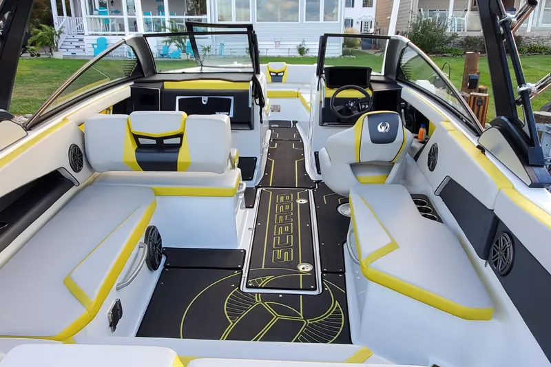 Slide: The Image of 2024 Scarab 285 Wake ID boat interior with modern seating and sleek design. - 29