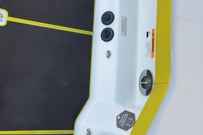 Slide: The Image of 2024 Scarab 285 Wake ID boat deck with yellow trim and safety warnings. - 30