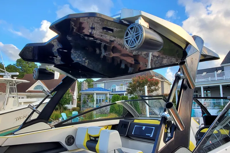 Slide: The Image of 2024 Scarab 285 Wake ID boat with sleek design and modern audio system. - 32