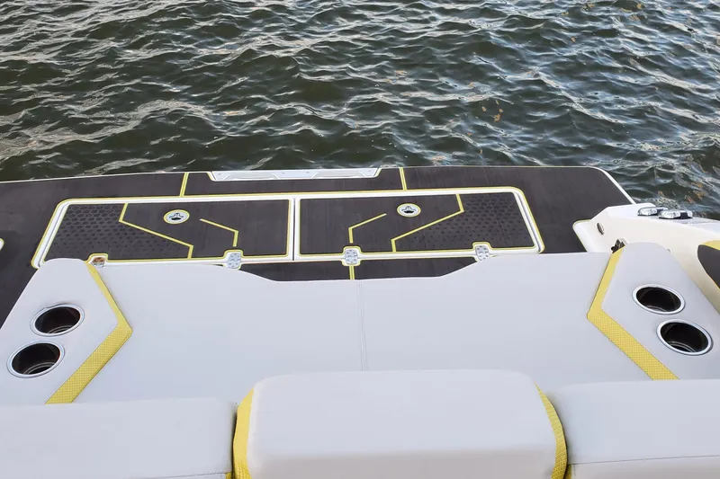Slide: The Image of 2024 Scarab 285 Wake ID boat deck with stylish seating and cup holders. - 6