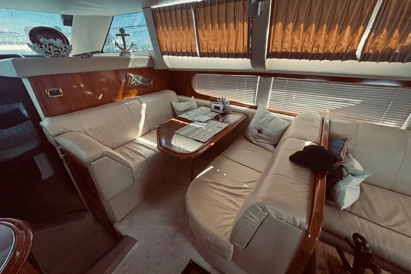 Slide: The Image of Luxurious interior of 2005 Carver 466 Motor Yacht with plush seating and elegant decor. - 18