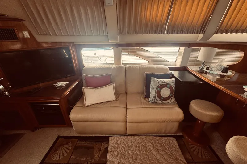 Slide: The Image of Interior of 2005 Carver 466 Motor Yacht with beige sofa and decorative pillows. - 20
