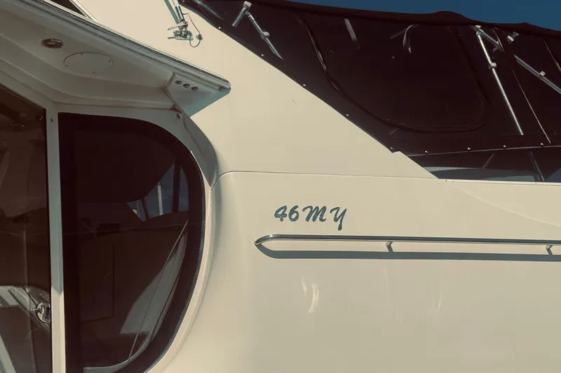 Slide: The Image of 2005 Carver 466 Motor Yacht exterior with "46MY" marking, showcasing sleek design. - 4