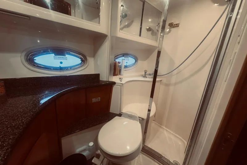 Slide: The Image of Bathroom interior of 2005 Carver 466 Motor Yacht with shower and porthole window. - 43