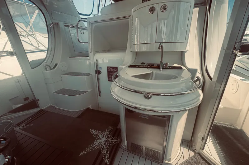 Slide: The Image of 2005 Carver 466 Motor Yacht interior with sink, steps, and nautical decor. - 7