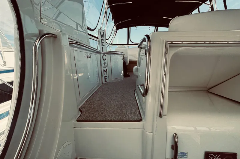 Slide: The Image of Interior view of 2005 Carver 466 Motor Yacht with welcome sign and sleek design. - 8