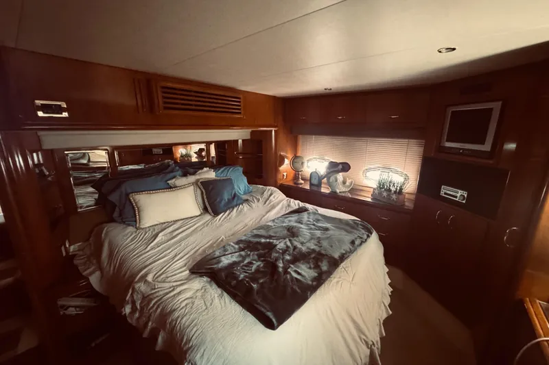 Slide: The Image of Luxurious bedroom interior of 2005 Carver 466 Motor Yacht with cozy bedding and decor. - 14