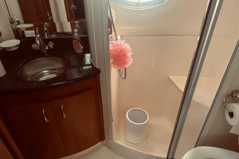 Slide: The Image of Bathroom interior of 2005 Carver 466 Motor Yacht with sink and shower. - 22