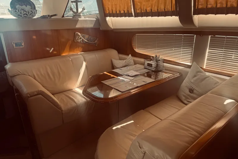 Slide: The Image of Luxurious interior of 2005 Carver 466 Motor Yacht with leather seating and elegant decor. - 23