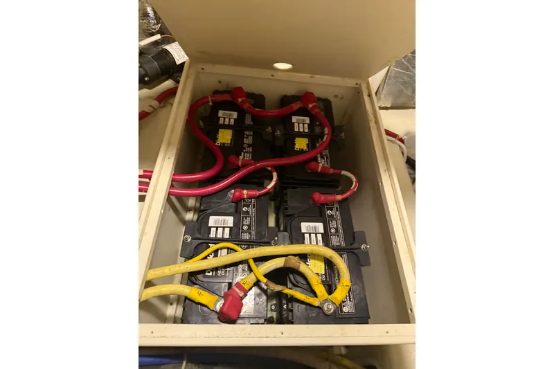 Slide: The Image of Battery compartment of 2005 Carver 466 Motor Yacht with red and yellow cables. - 31