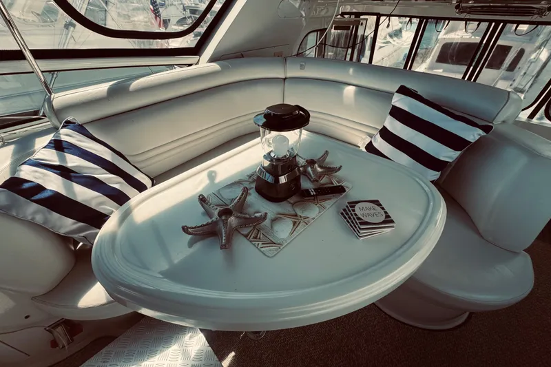 Slide: The Image of Luxurious interior of 2005 Carver 466 Motor Yacht with striped pillows and nautical decor. - 9