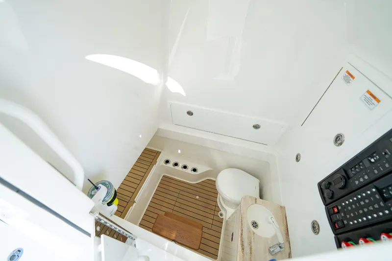 Slide: The Image of 2023 Valhalla Boatworks V-37 interior with modern bathroom and control panel. - 11