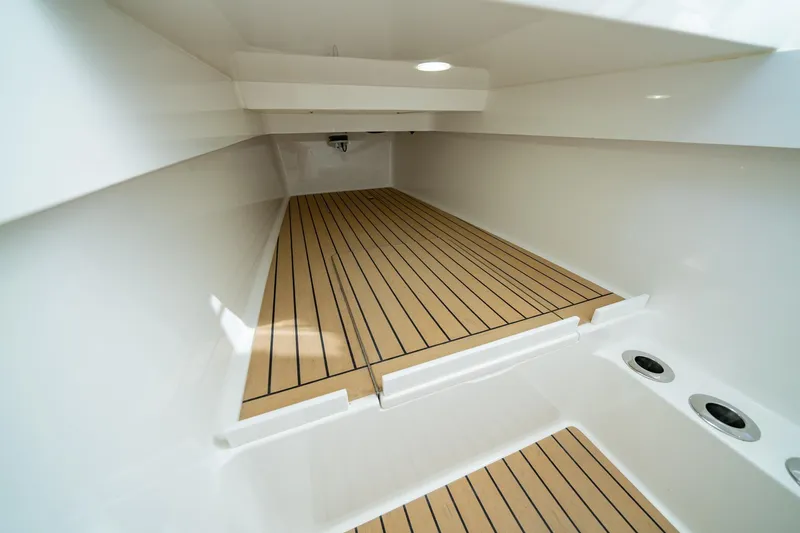 Slide: The Image of 2023 Valhalla Boatworks V-37 interior with sleek wooden flooring. - 12