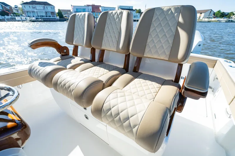 Slide: The Image of Luxurious seating on 2023 Valhalla Boatworks V-37, featuring diamond-stitched upholstery. - 17