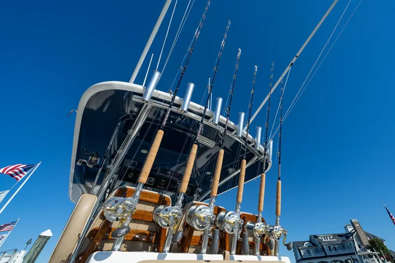 Slide: The Image of 2023 Valhalla Boatworks V-37 with fishing rods against clear blue sky. - 26