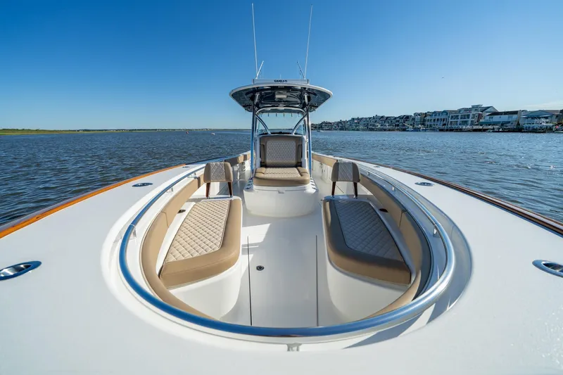 Slide: The Image of 2023 Valhalla Boatworks V-37 on water, featuring luxurious seating and sleek design. - 7