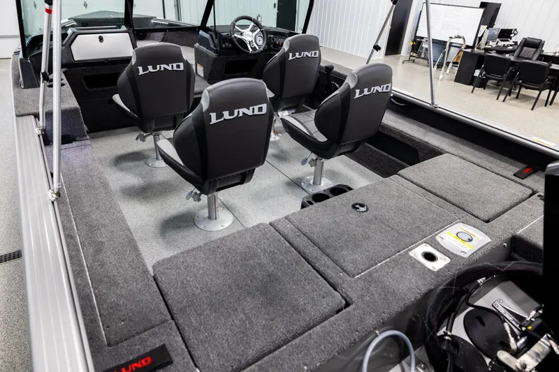 Slide: The Image of 2026 Lund 2075 Impact XS boat interior with four seats and spacious layout. - 10