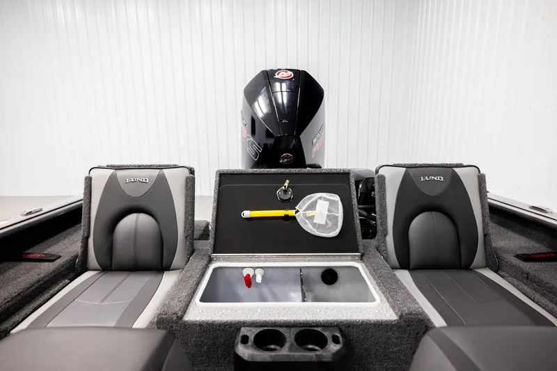 Slide: The Image of 2026 Lund 2075 Impact XS boat interior with seating and storage compartments. - 18