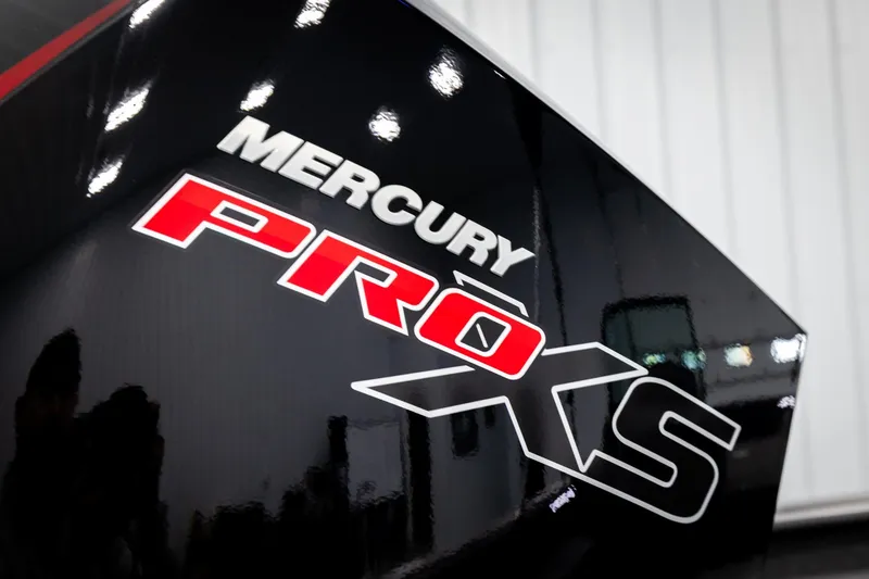 Slide: The Image of Close-up of Mercury Pro XS logo on 2026 Lund 2075 Impact XS boat. - 50