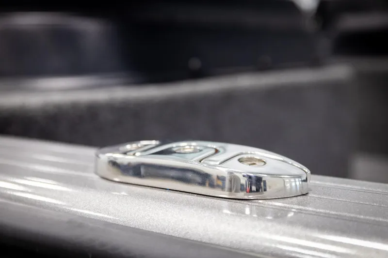 Slide: The Image of Close-up of a metallic fixture on a 2026 Lund 2075 Impact XS boat. - 61
