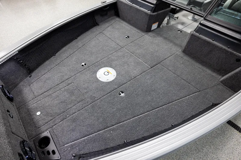 Slide: The Image of 2026 Lund 2075 Impact XS boat interior with spacious carpeted deck. - 9