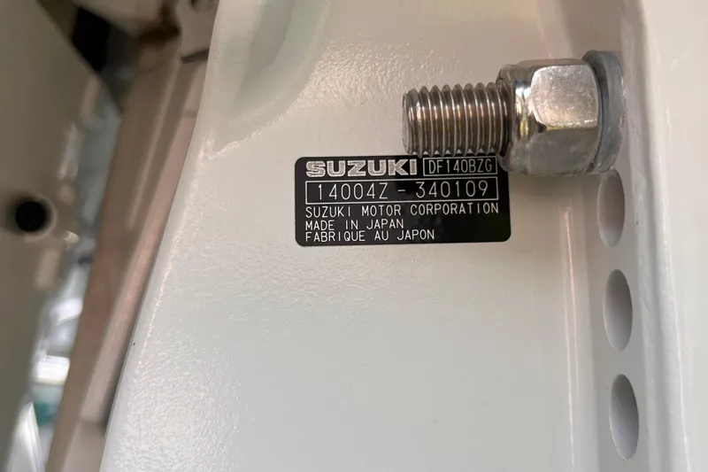 Slide: The Image of Label on Suzuki motor, model DF140BZG, attached to Falcon Boats F22, 2023. - 16