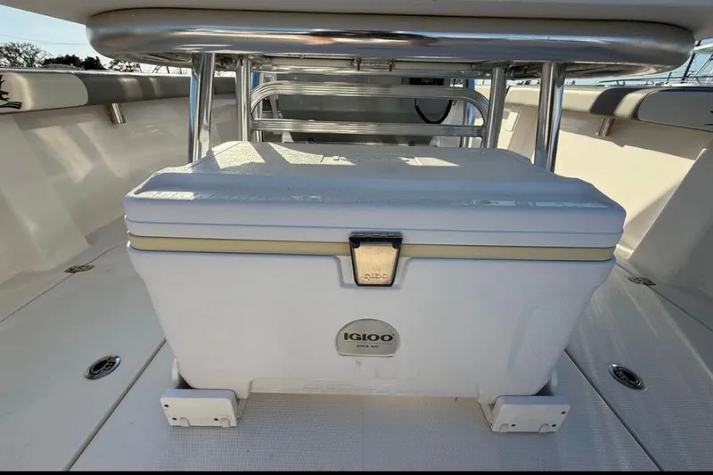 Slide: The Image of 2023 Falcon Boats F22 deck with Igloo cooler and stainless steel railings. - 19