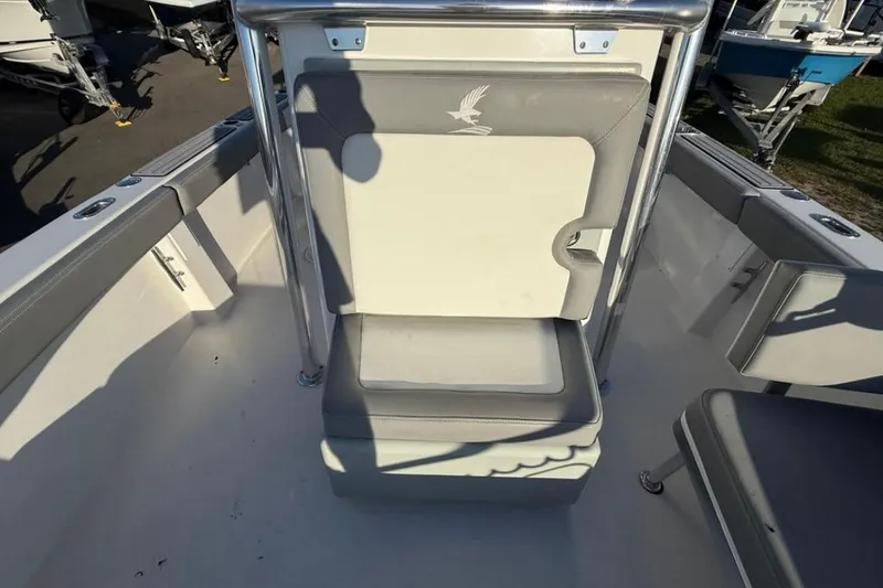 Slide: The Image of 2023 Falcon Boats F22 interior with cushioned seating and stainless steel frame. - 20