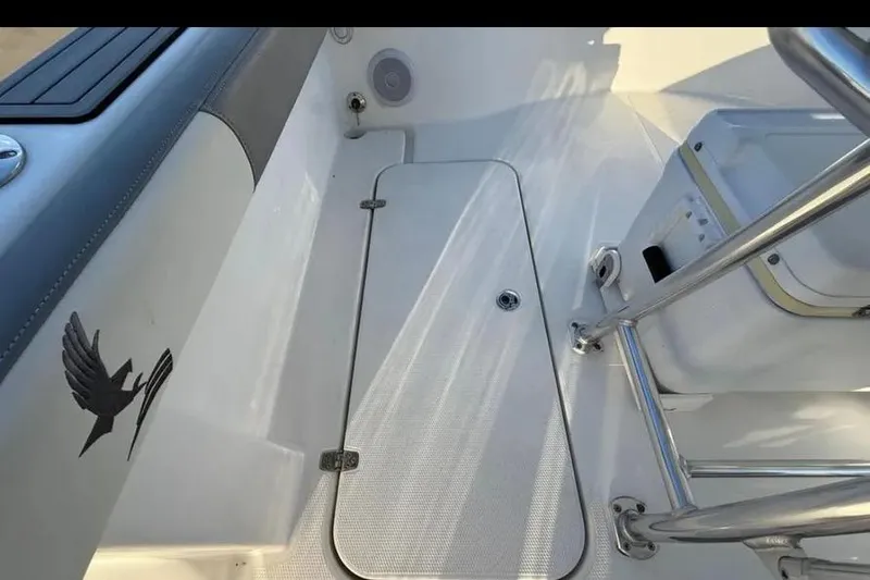 Slide: The Image of 2023 Falcon Boats F22 interior with storage compartment and seating area. - 30