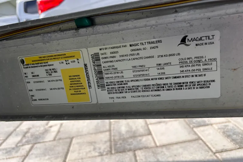 Slide: The Image of Trailer label for 2023 Falcon Boats F22, detailing tire and loading information. - 35
