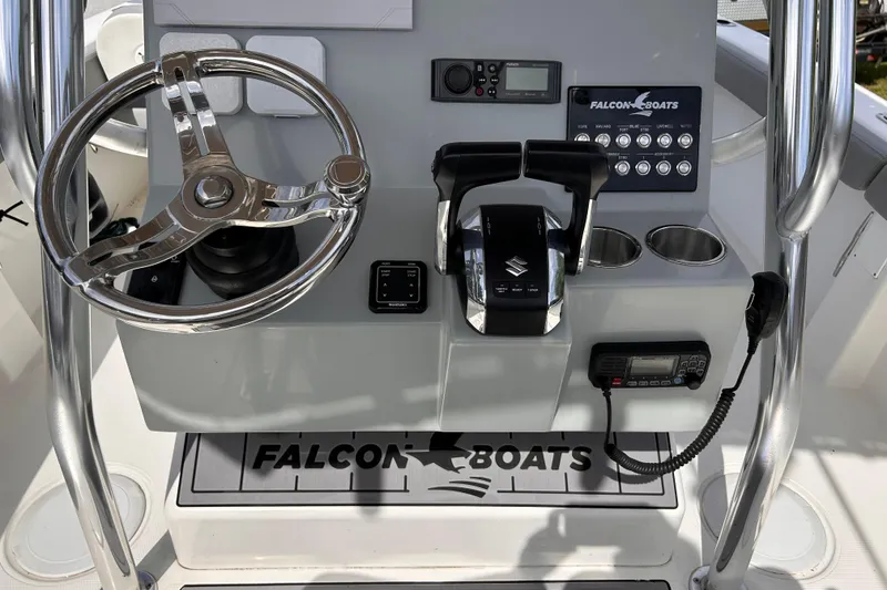 Slide: The Image of 2023 Falcon Boats F22 dashboard with steering wheel and controls. - 6