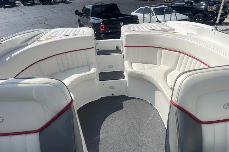 Slide: The Image of 2004 Cobalt 282 boat interior with white seating and red accents. - 17