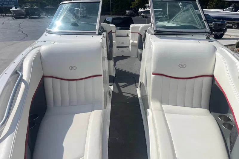 Slide: The Image of 2004 Cobalt 282 boat interior with white seating and red accents. - 21