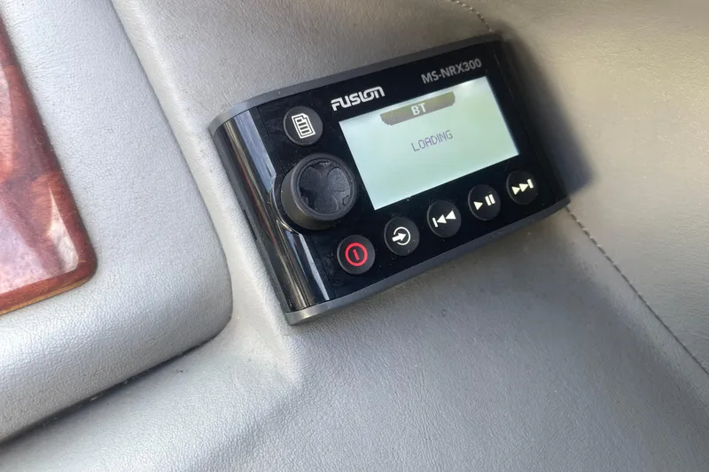 Slide: The Image of Fusion MS-NRX300 audio control panel in a 2004 Cobalt 282 boat. - 24