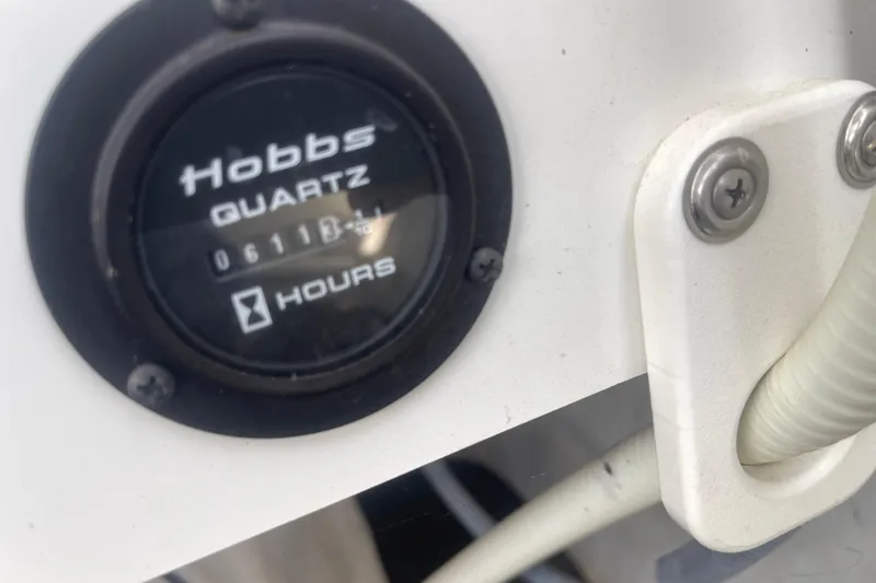 Slide: The Image of Hobbs Quartz hour meter on 2004 Cobalt 282 boat, displaying 611.3 hours. - 29