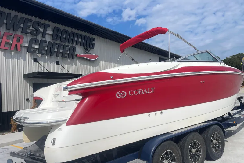 Slide: The Image of Red and white 2004 Cobalt 282 boat on trailer at boating center. - 4