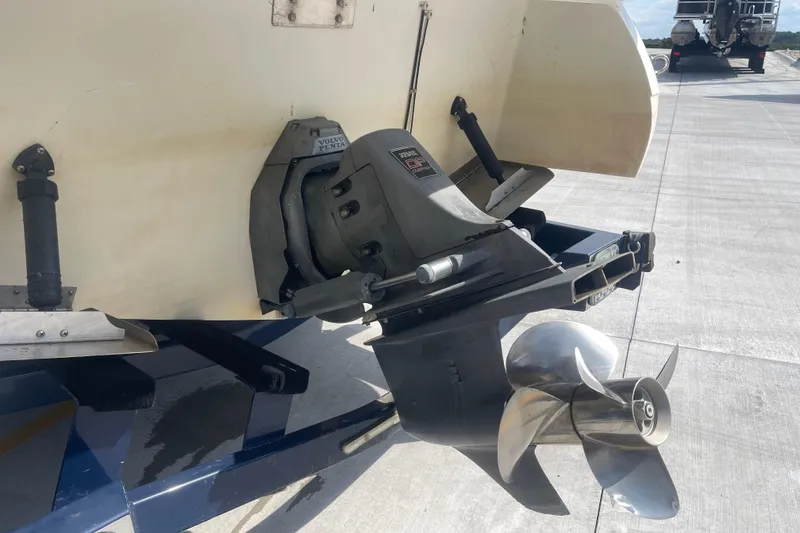 Slide: The Image of 2004 Cobalt 282 boat with Volvo Penta outdrive and propeller on a concrete surface. - 7