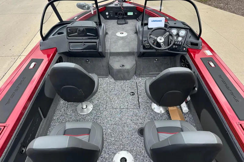 Slide: The Image of 2026 Tracker Targa V-19 Combo boat interior with four seats and modern dashboard. - 7