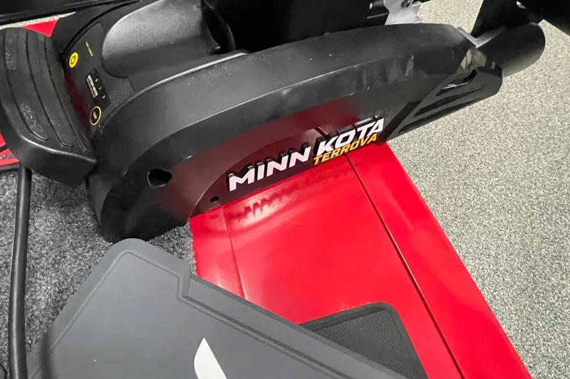 Slide: The Image of 2026 Tracker Targa V-19 Combo boat storage compartment with gear inside. - 15