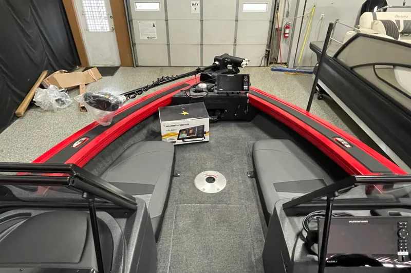 Slide: The Image of 2026 Tracker Targa V-19 Combo boat interior layout, featuring seating and storage compartments. - 6