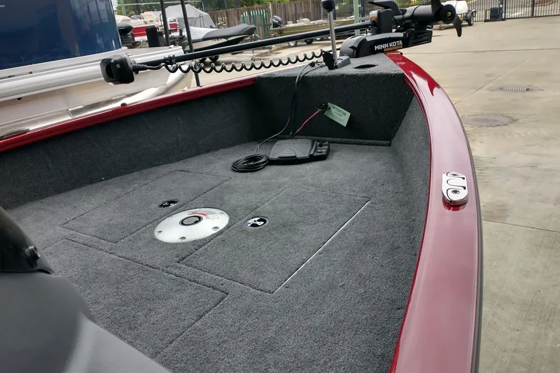 Slide: The Image of 2026 Tracker Super Guide V-16 SC boat interior with Minn Kota trolling motor. - 2